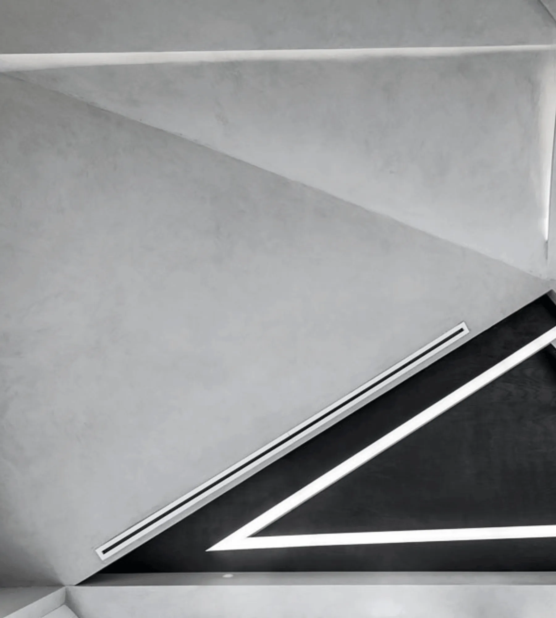 Folded concrete ceiling planes meeting at a dark recess, with a single continuous strip of light drawn along the seam.